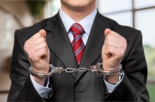 Person handcuffed for white collar crimes